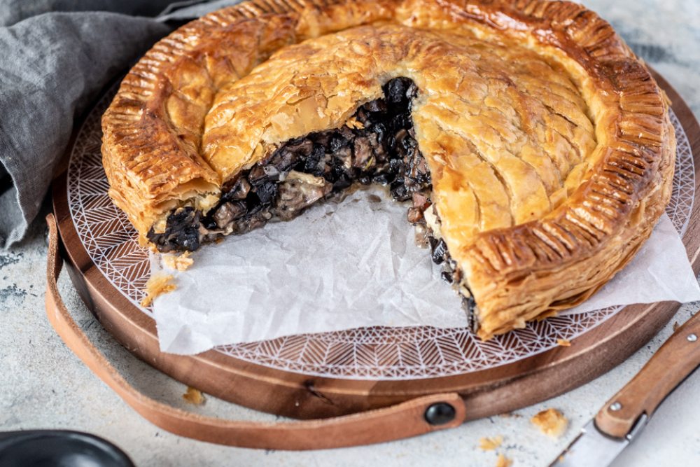 A golden, flaky pastry crust stuffed with earthy mushrooms and creamy camembert makes this rich pithivier a dish worthy of any table